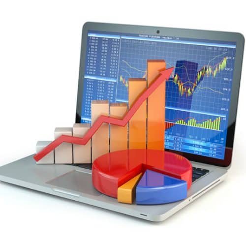 laptop with stock charts and graphs
