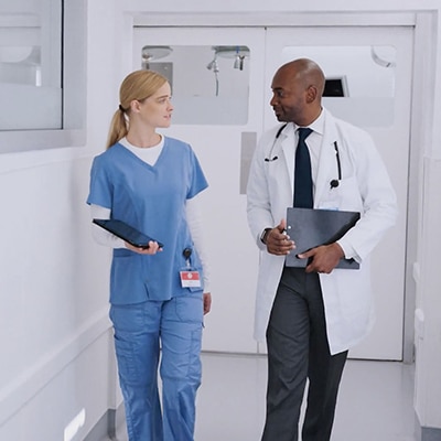 doctor and nurse walking together