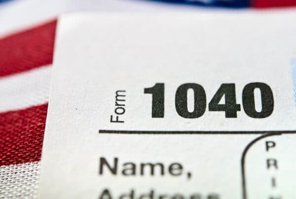 tax form 1040 and american flag