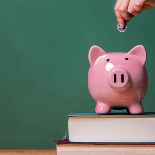 Image showing piggy bank and books for what you need to know if you inherit an ira