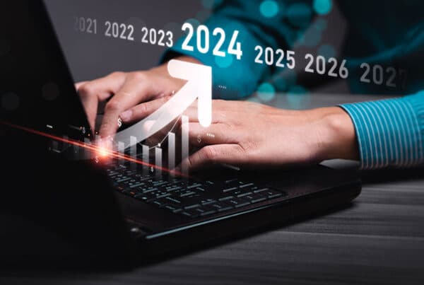 woman looking at stock market on laptop