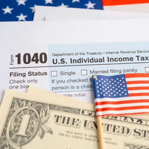 image showing us dollar, flag and tax form