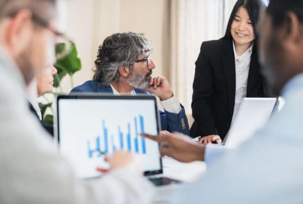Business people in suits having a meeting