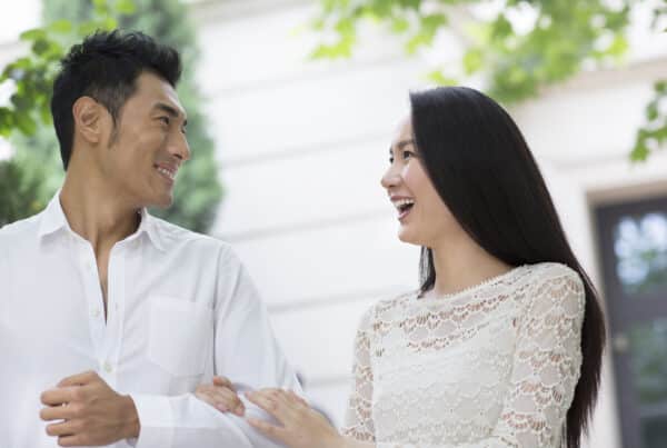 Young couple in white out on a walk