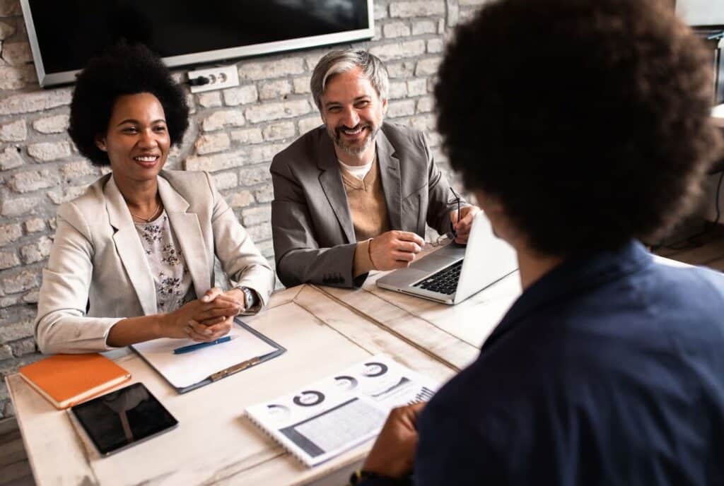 couple speaking with a registered investment advisor