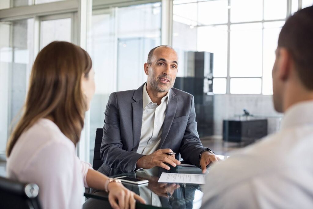 couple discussing service level involvement with wealth management firm
